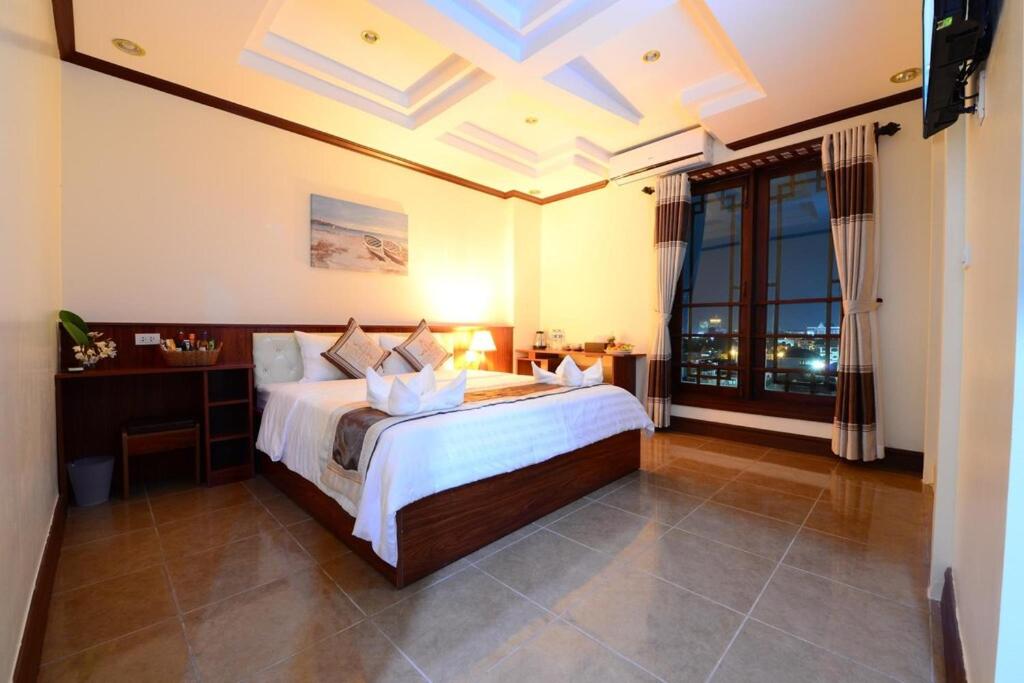Deluxe Double room with a double bed and a private balcony