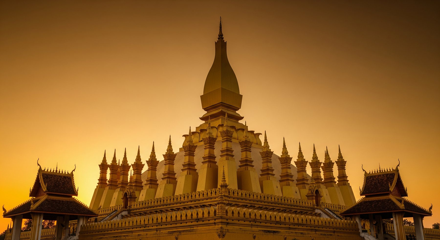 Golden temples at sunset — minutes from Vientiane Luxury Hotel